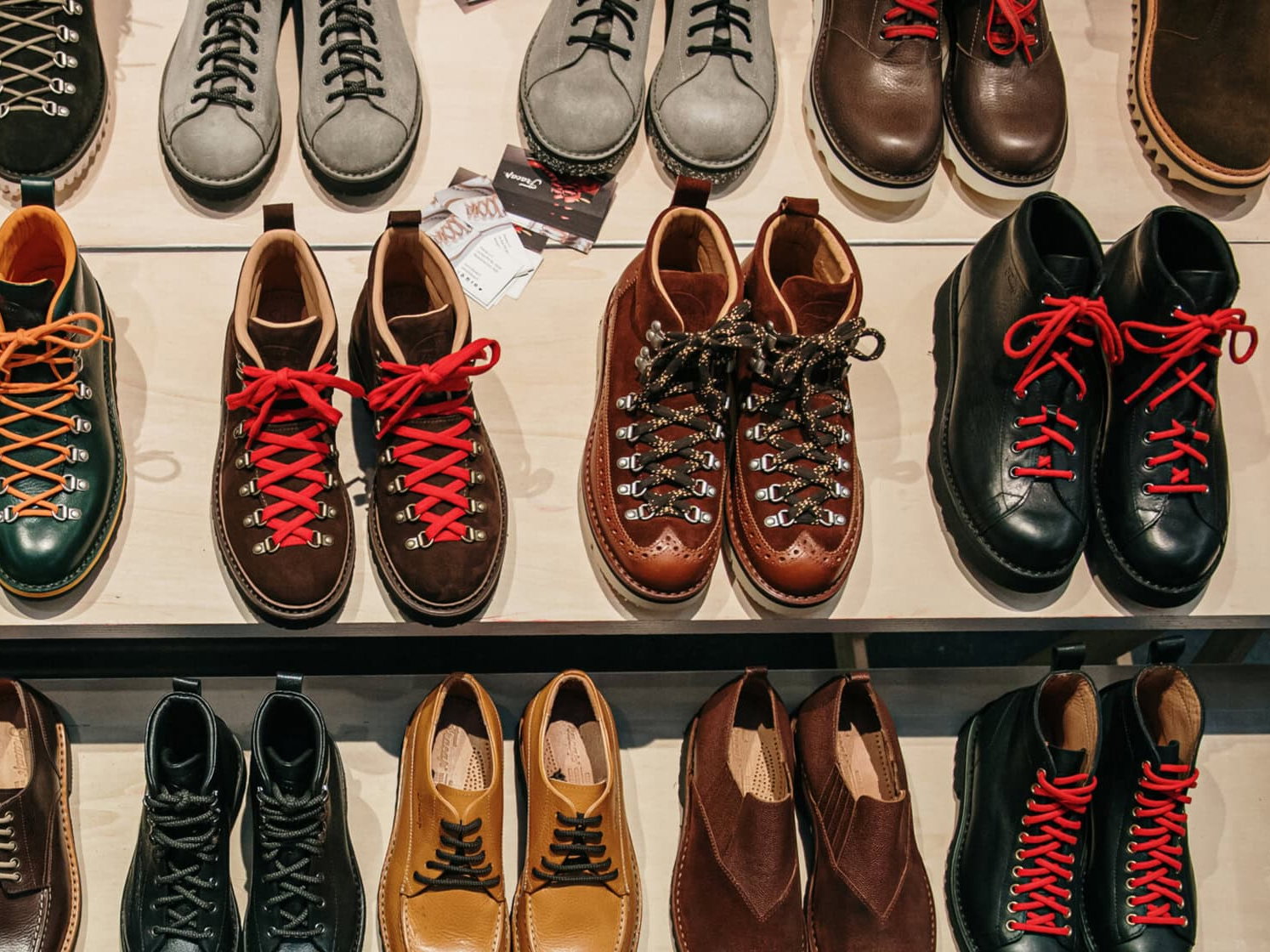 a variety of boots on display in a shoe store