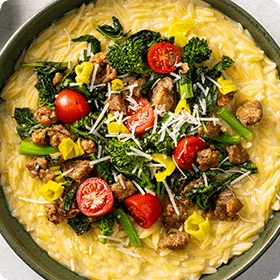 Creamy Orzo with Hot Italian Sausage, Broccoli Rabe, and Tomatoes