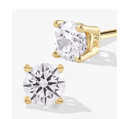 Round diamond stud earrings in yellow gold.