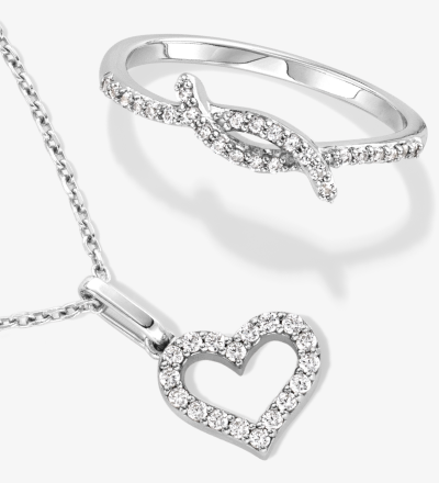 Silver heart pendant necklace paired with a diamond-accent infinity ring.