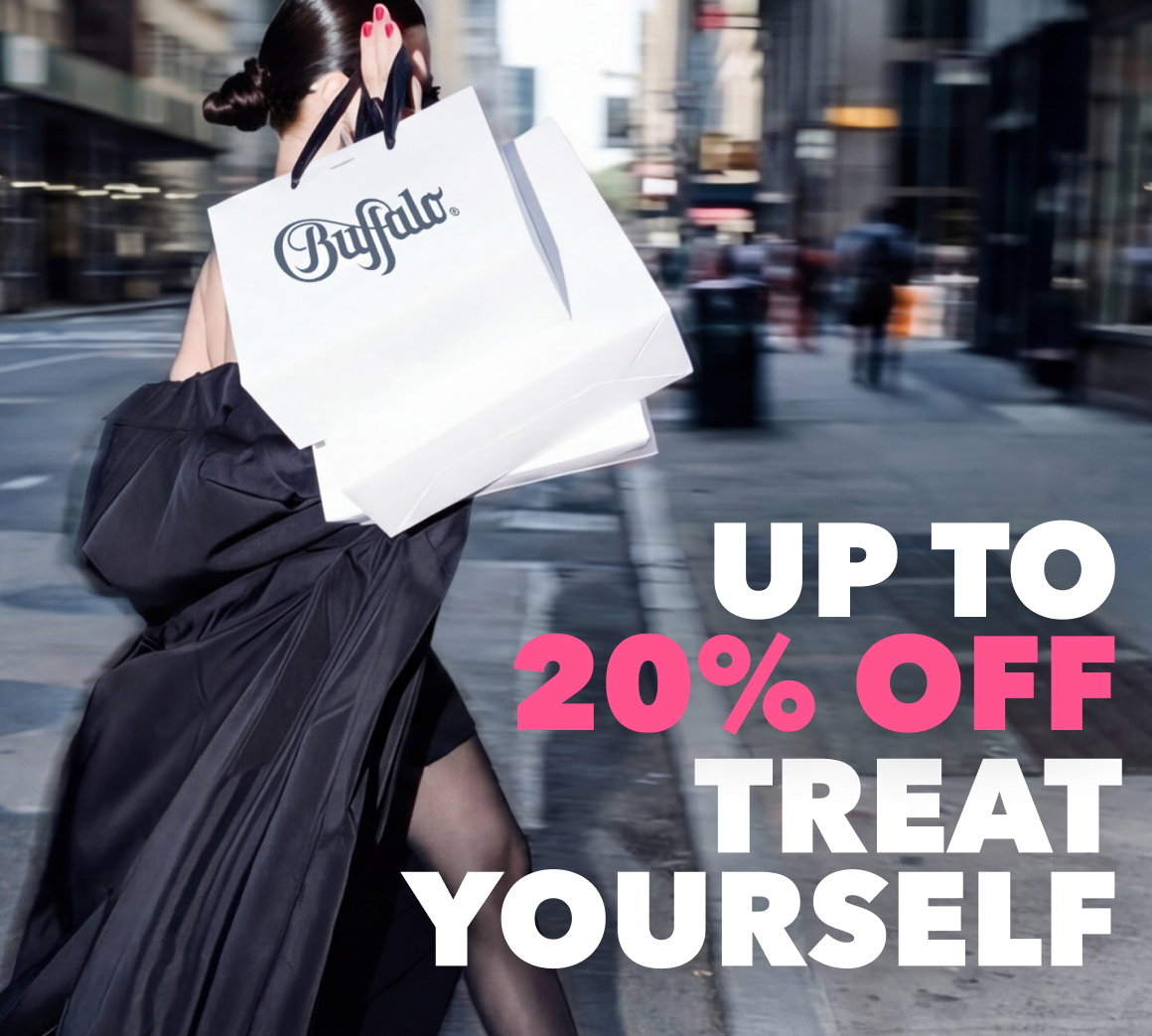 Woman walking through a city street carrying Buffalo shopping bags, with promotional text “Up to 20% off – Treat Yourself.