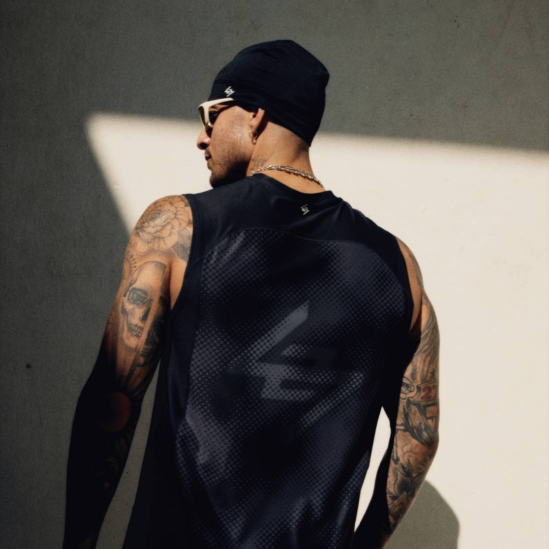 Athlete wearing the 247 Hybrid Tank and 247 Skull Cap