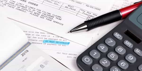 calculator and billing paperwork