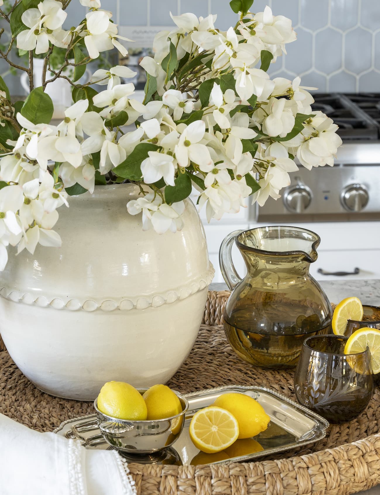 tray with vase of faux dogwood stems 