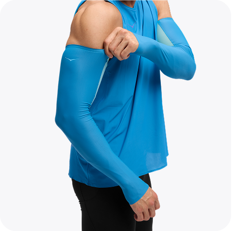 Images of two people posing wearing the Trail Run Vest in White, a person wearing the Airolite Arm Sleeves in HOKA Blue, and a person wearing the Airolite Run Gloves in Black.