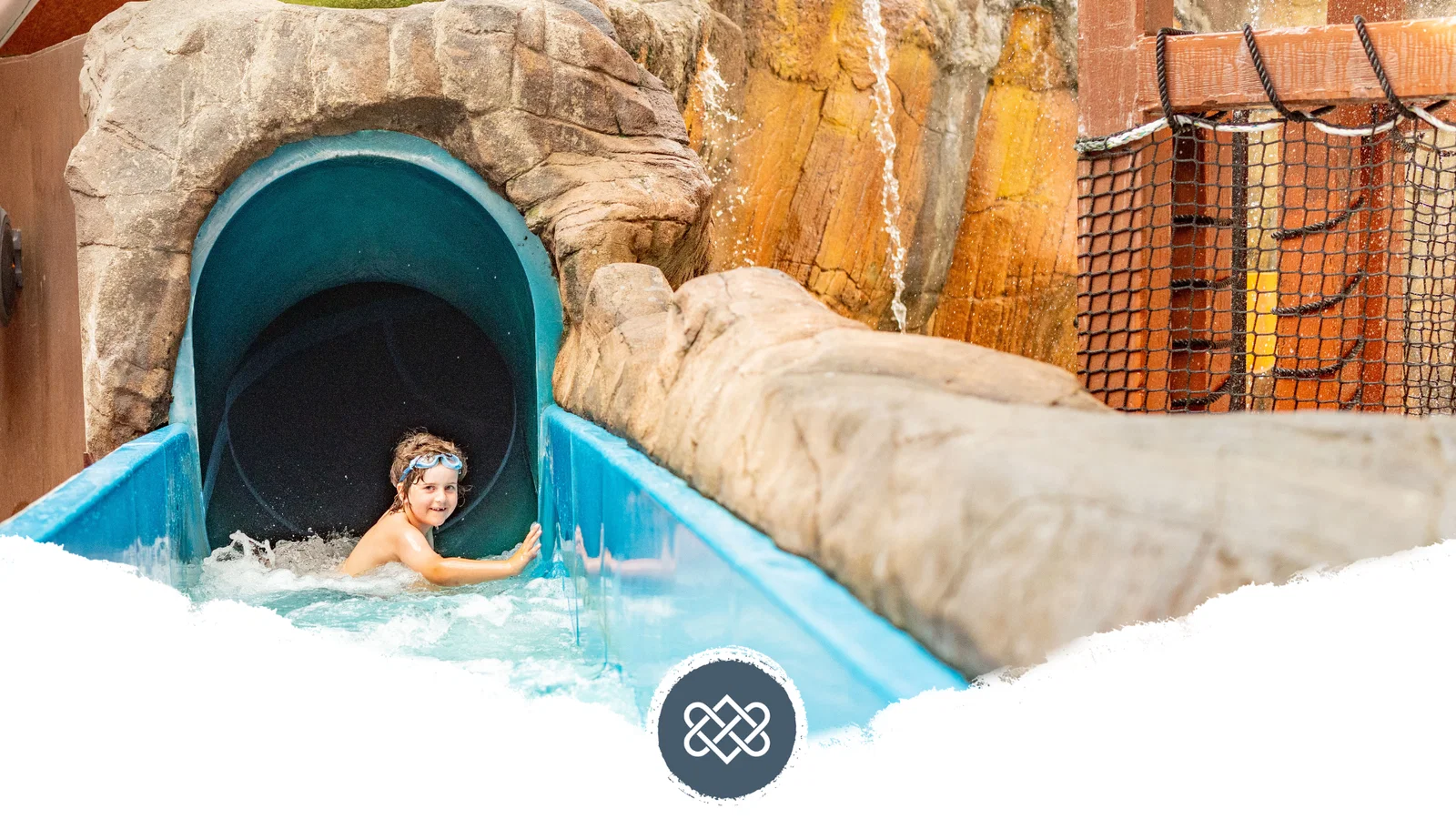 boy going down slide at blue lagoon