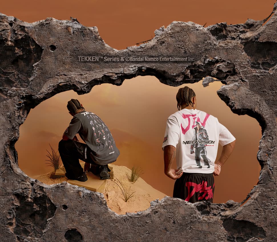 an image of two people looking out of a hole in a rock