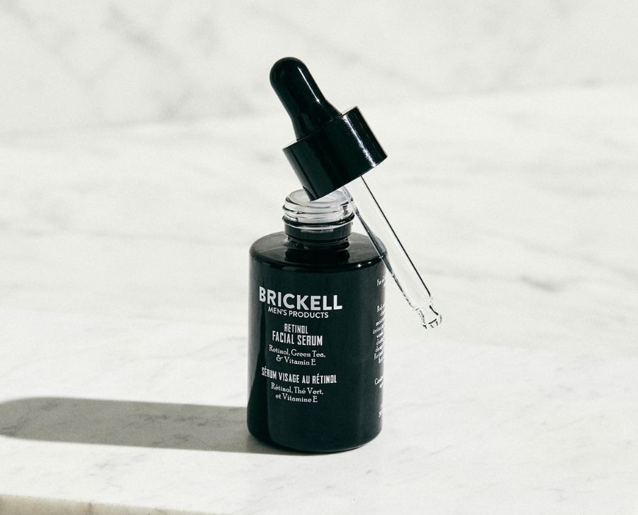 an image of a bottle of brickell's skin care product on a marble counter