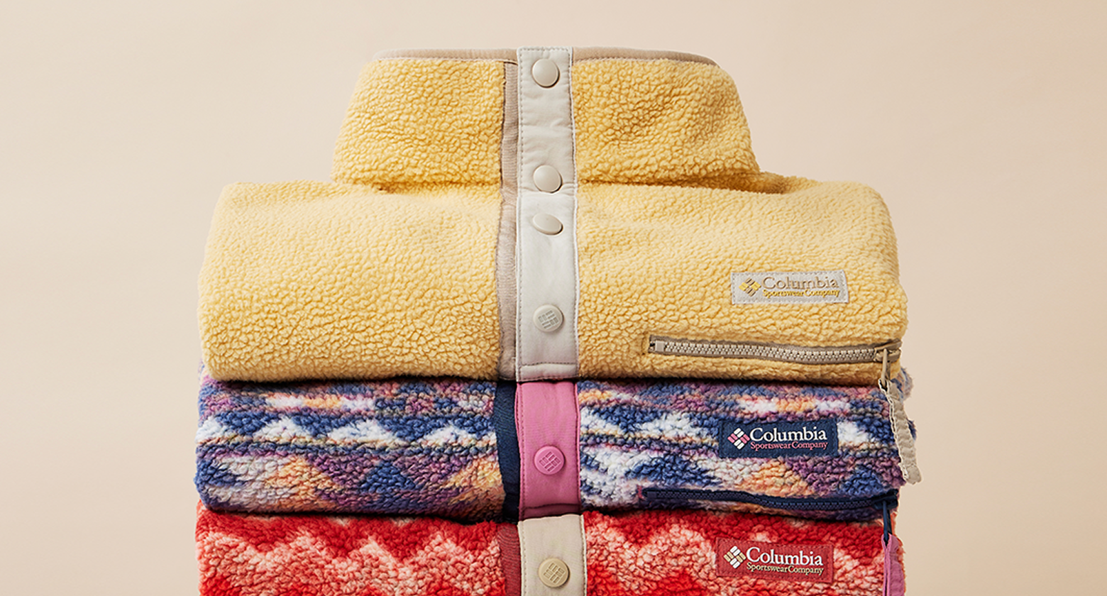 A neat stack of colorful Helvetia fleece jackets. 