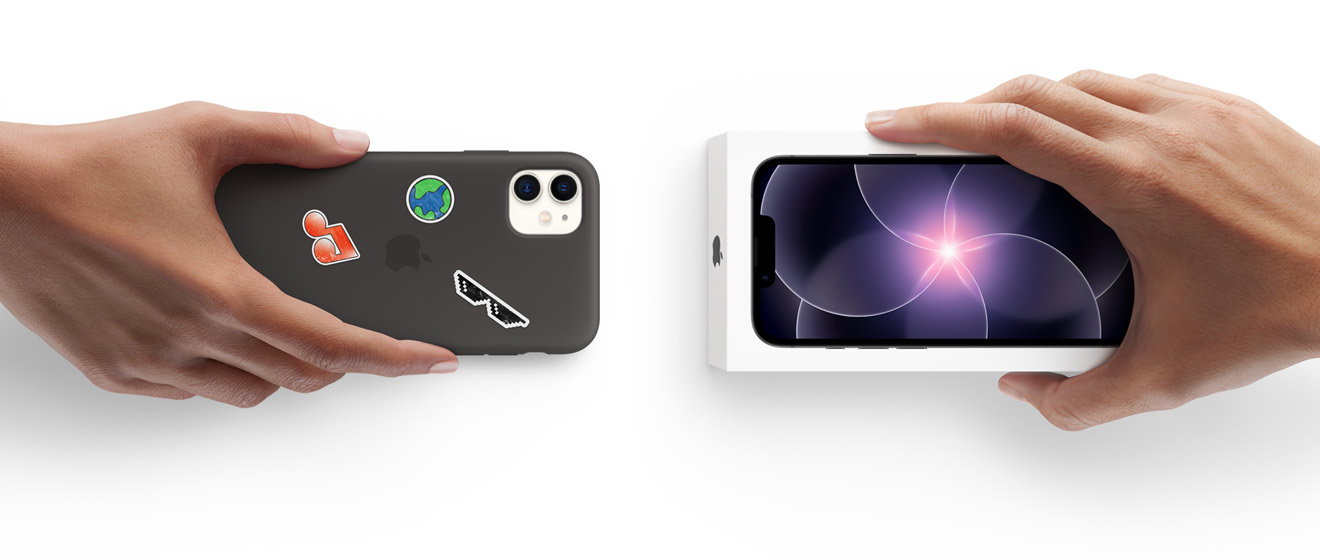 Hands of two different people exchanging a used iPhone with a new iPhone