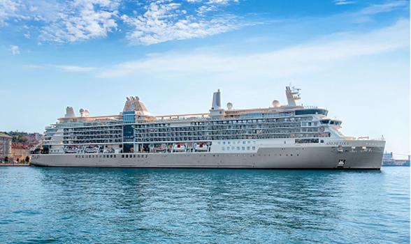 The Silver Nova cruise ship docked in blue waters under a clear sky.