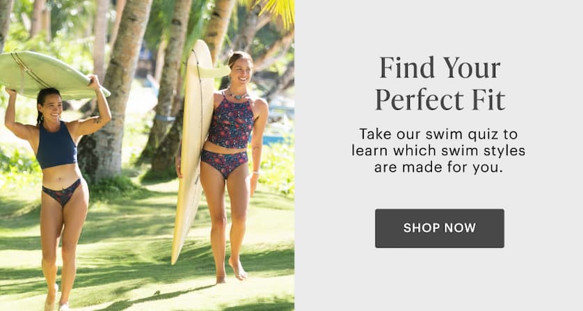 Find Your Perfect Fit - Women walking with surfboard through grassy area with palms. 