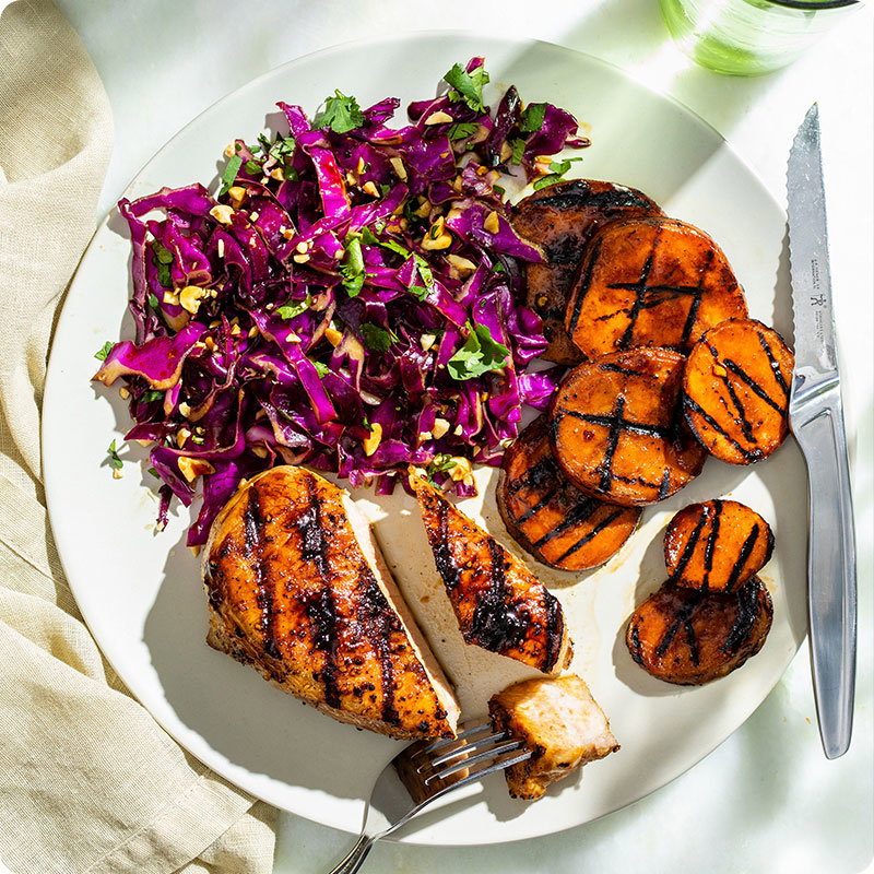 Molasses-Glazed Pork Chops with Sweet Potatoes and Red Cabbage Slaw