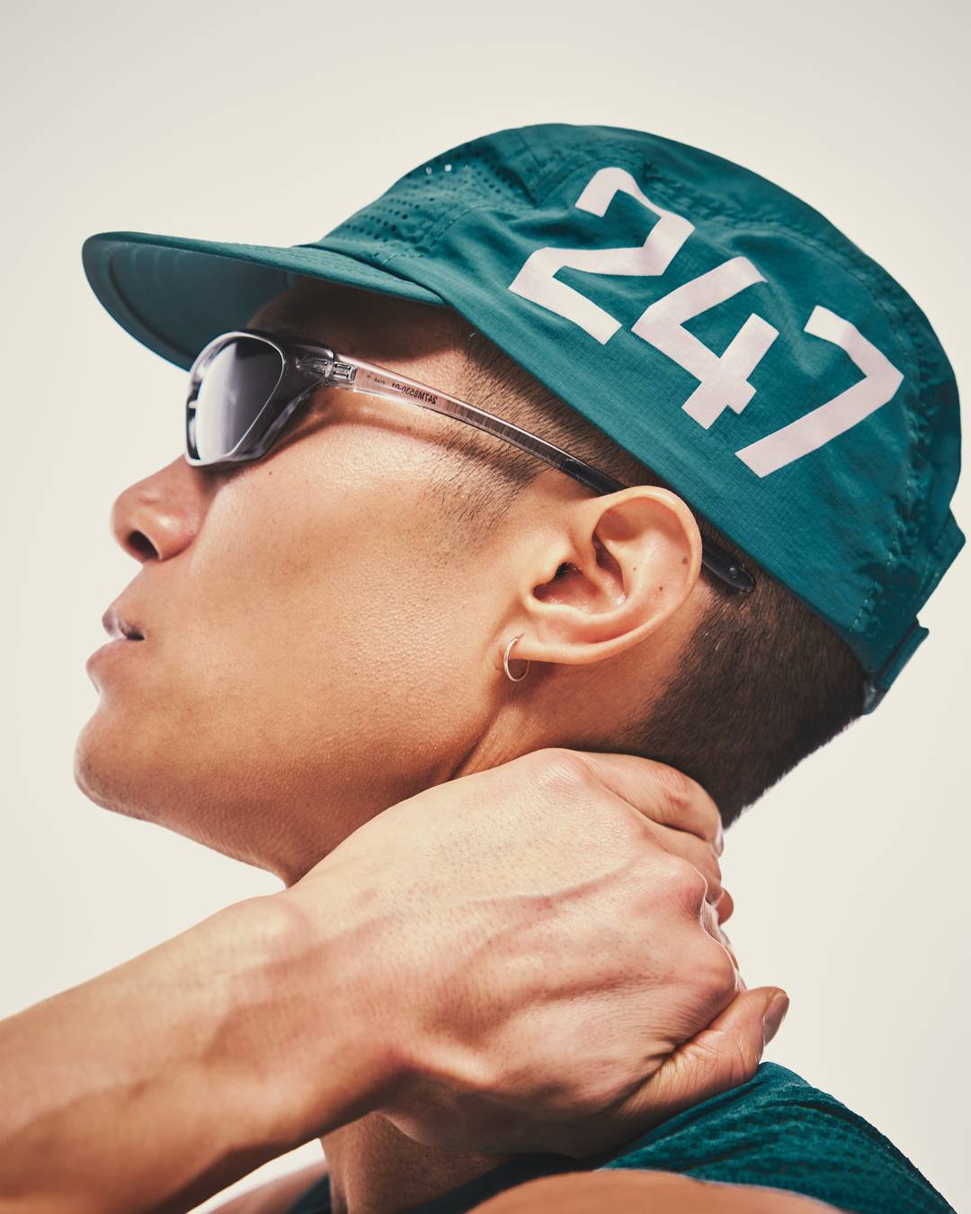 Model wearing the 247 Numbers Cap in Teal