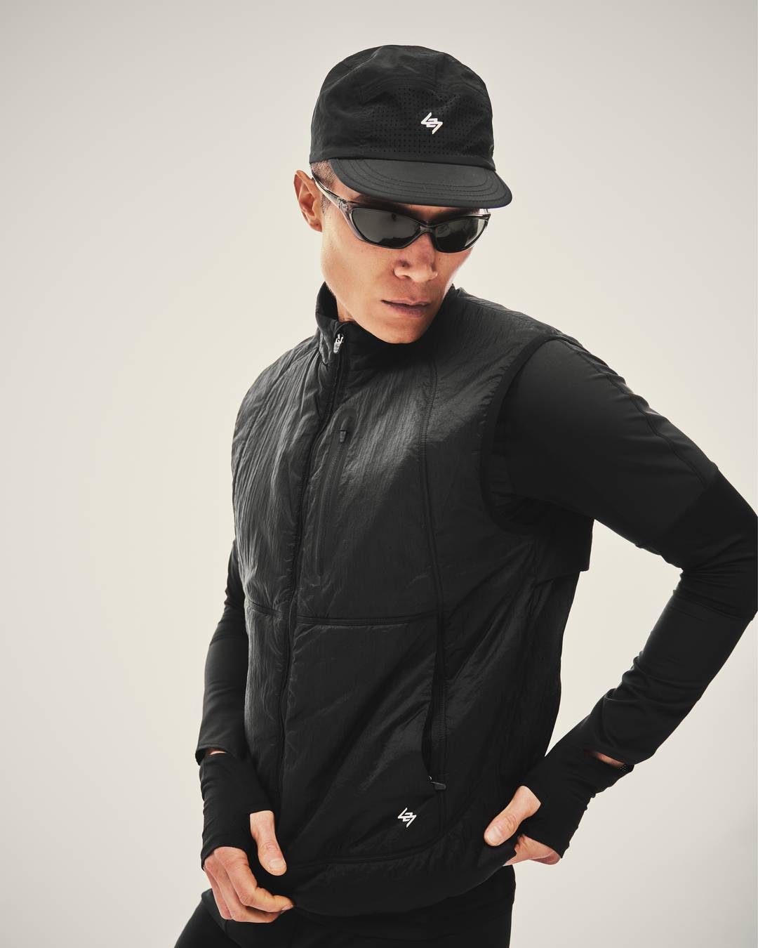 Model wearing the 247 Run Gilet in Jet Black
