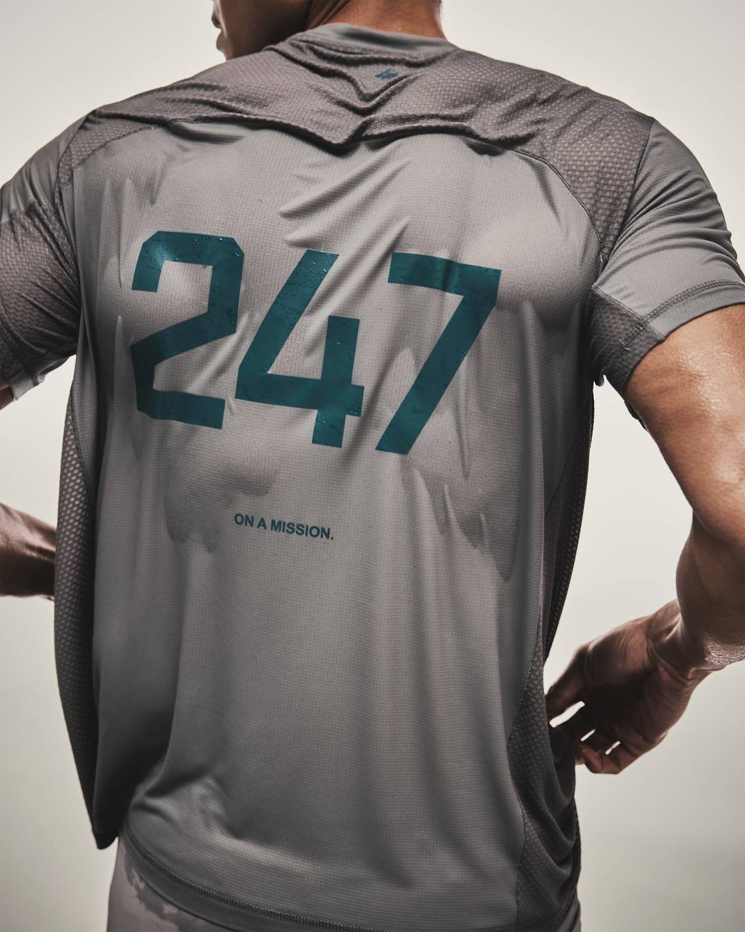 Model wearing the 247 Numbers T-Shirt in Graphite Grey