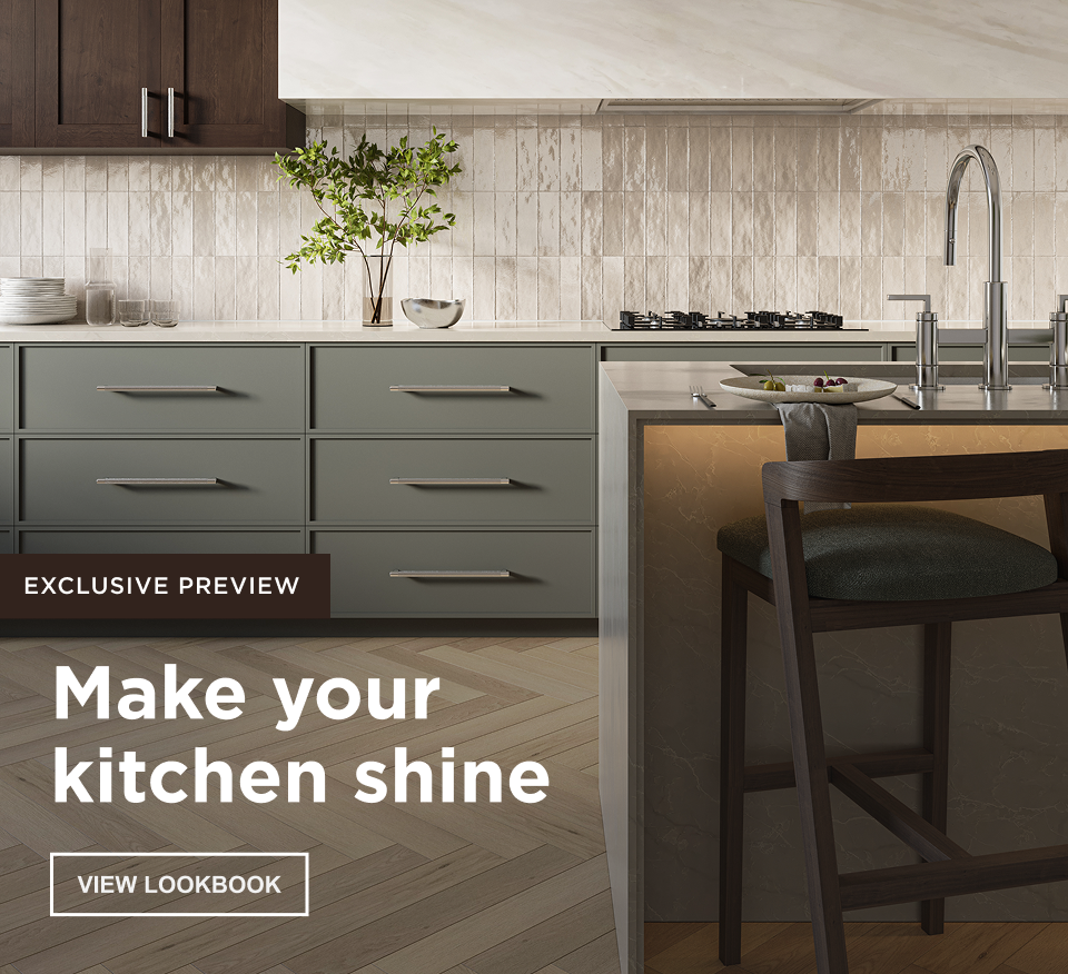 Make your kitchen shine. Exclusive Preview. Sleek kitchen with sage cabinetry, marble countertops, textured tile backsplash, warm herringbone wood floors, and modern chrome fixtures.