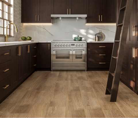 Warm wood tones meet sleek stainless steel in a modern kitchen with rich cabinetry, marble accents, brass hardware, and sunlit sophistication.