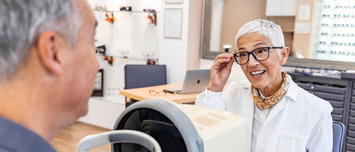 Optometrist talking with a patient