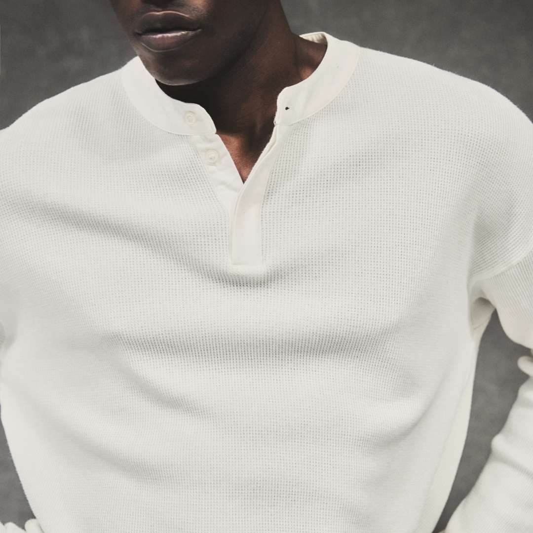 Model wearing the Initial Henley Waffle Long Sleeve T-Shirt in Flat White