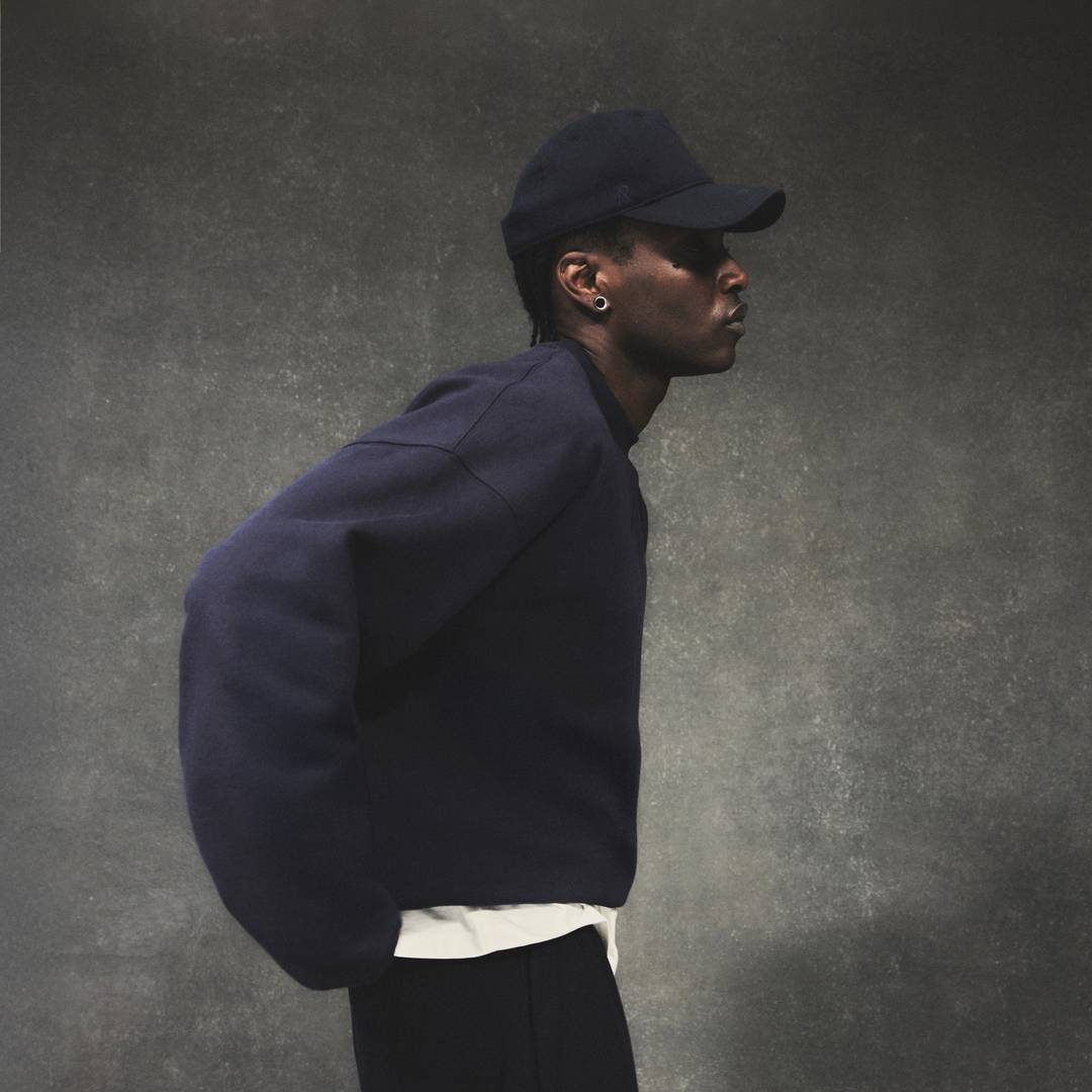 Model wearing the Initial Boxy Sweater and Jersey Cap in Midnight Navy