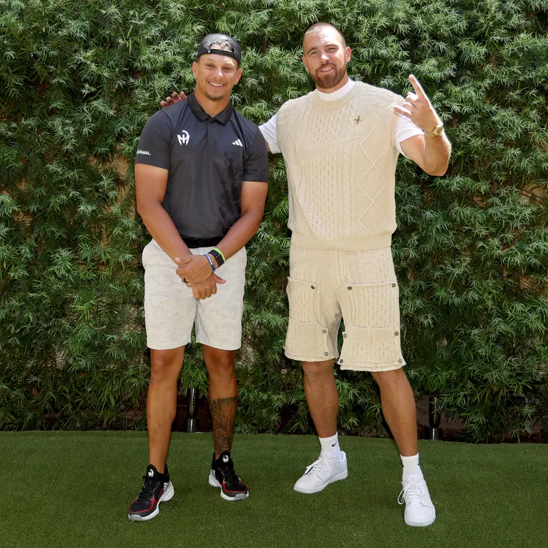 Patrick Mahomes (L) and Travis Kelce of the Kansas City Chiefs pose for photos 