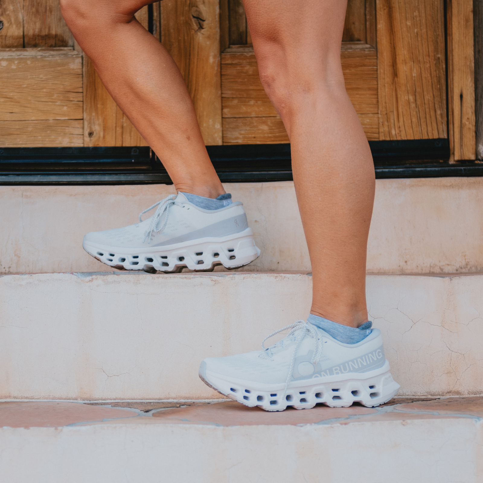 Woman wearing On Cloudmonster 3 shoes