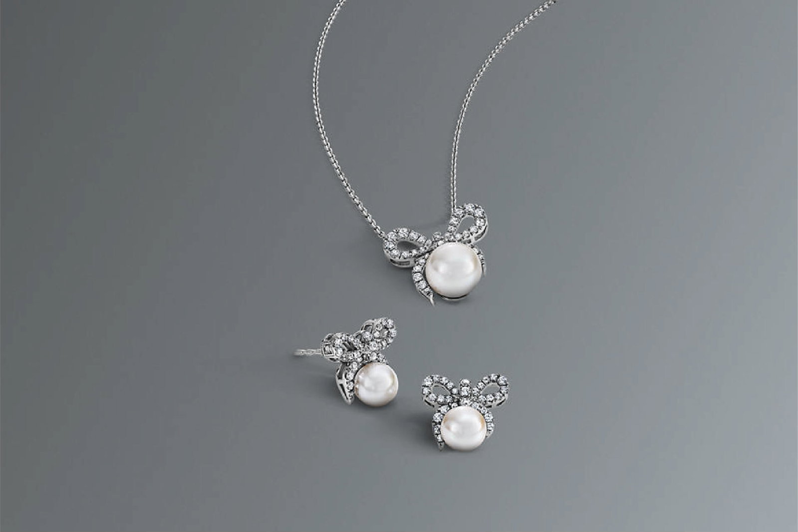 Monique Lhuillier Bliss x KAY Jewelers Pearl & Bow earrings and necklace