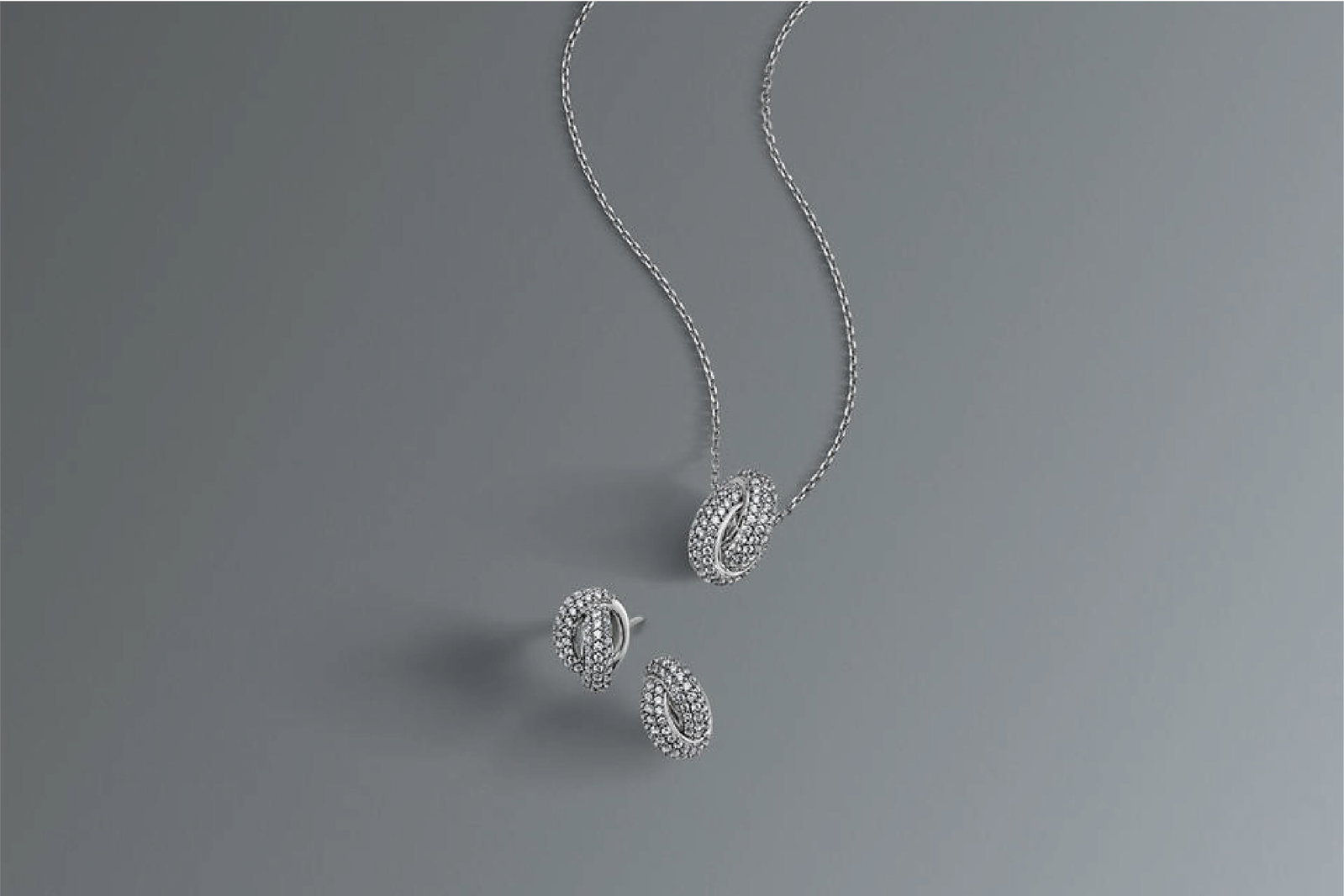 Monique Lhuillier Bliss x KAY Jewelers Love Knot earrings and necklace