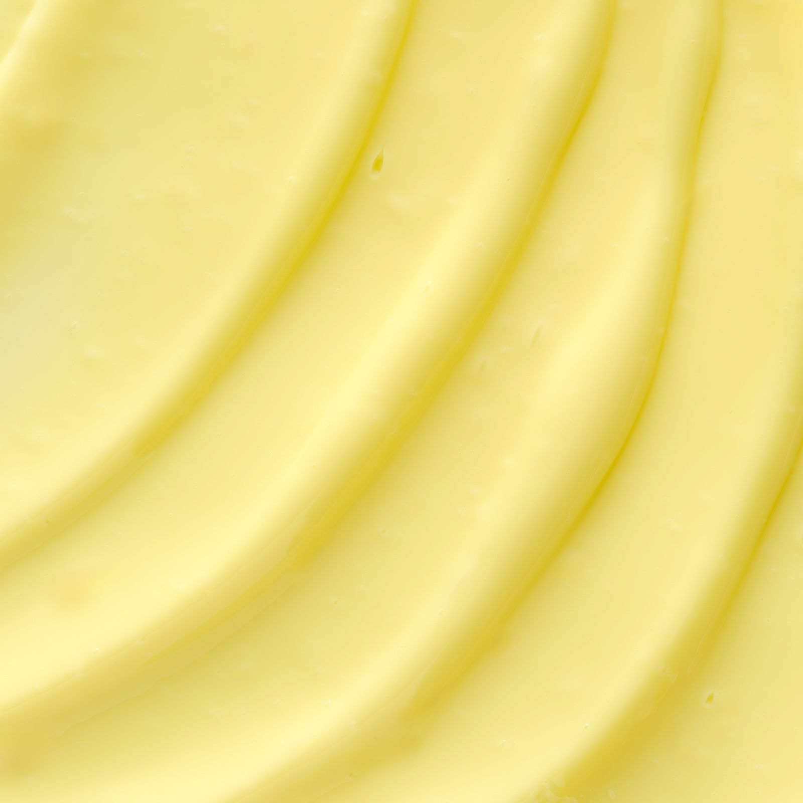 Yellow texture shot of Sun Soul Tan Maximizer