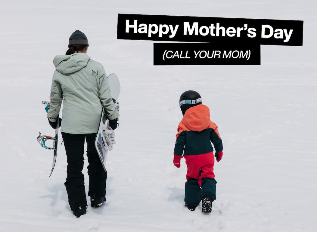 Woman and kid walking away from the camera in Burton Outerwear in the snow, with the text "Happy Mother's Day (Call Your Mom)"