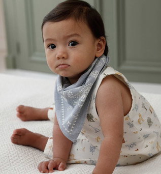 Set of baby sleepsuit and bandana