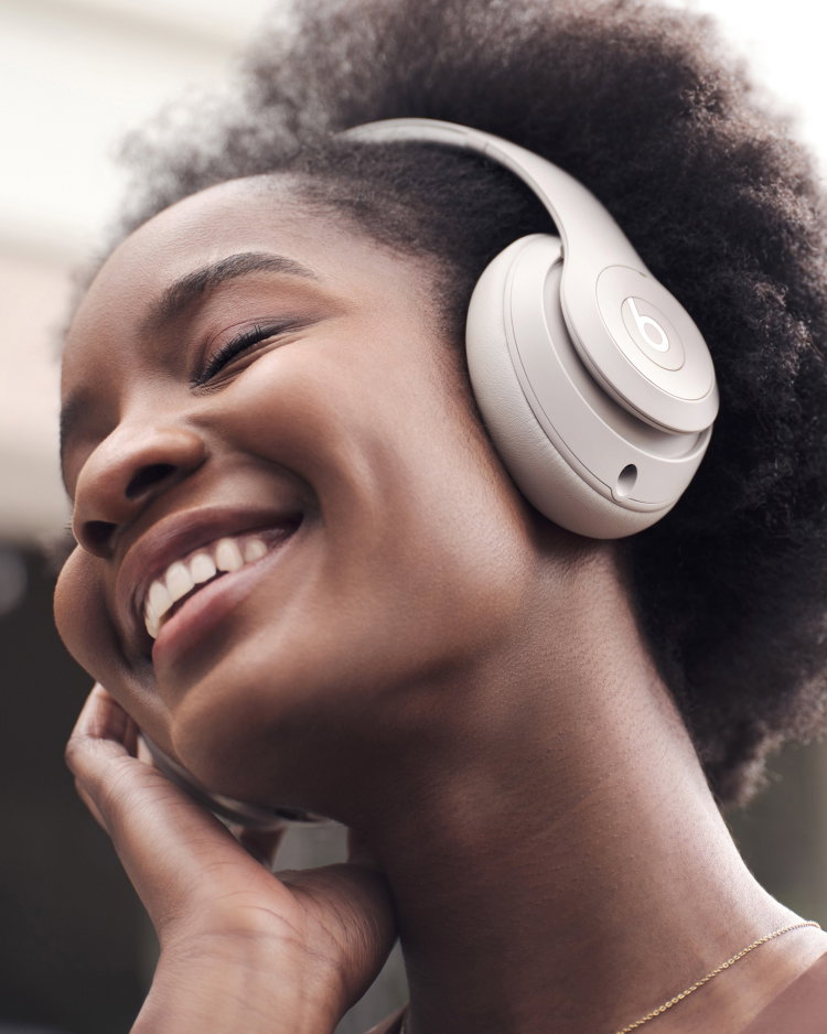 Woman wearing Beats Studio Pro headphones