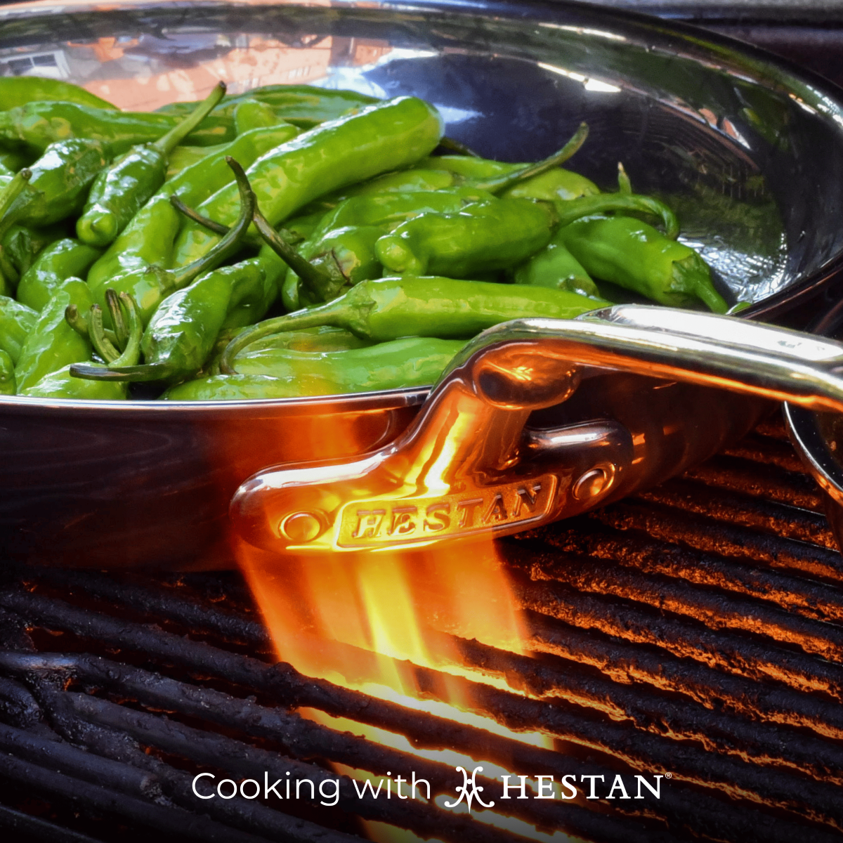 GIF: Cooking chili in Hestan skillet over a grill. Text that reads: "Cooking with Hestan"