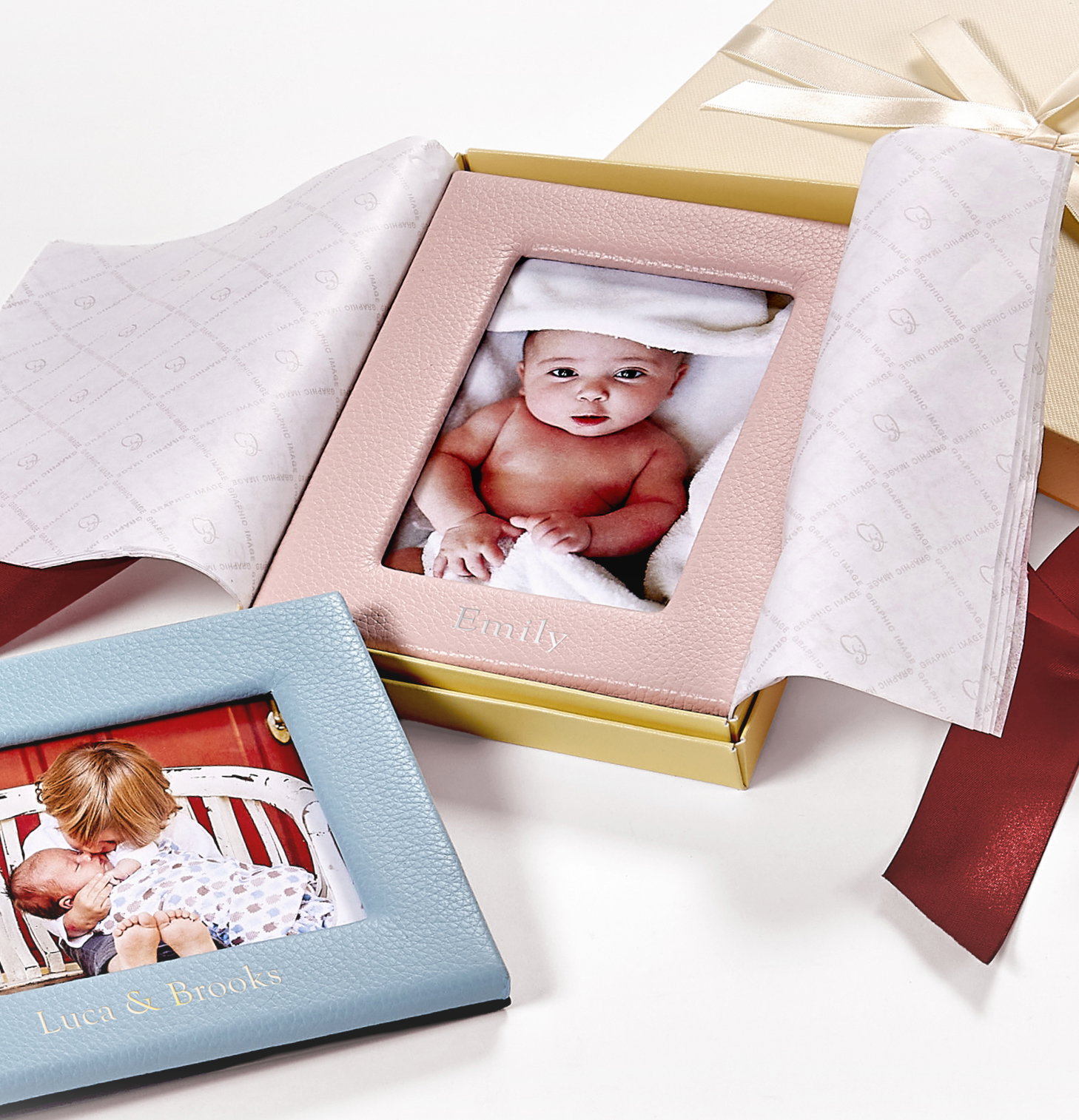 Personalized leather picture frames in gift boxes.