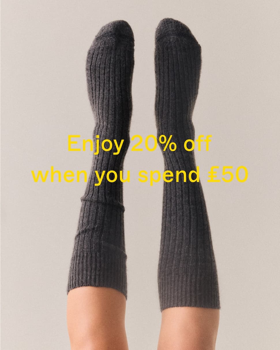 People wearing various socks with sale text overlay