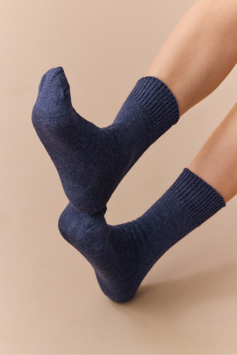 People wearing various socks with sale text overlay