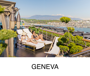 Two women rest on white lounge chairs overlooking the water, with a cityscape and mountains in the background. Text reads: Geneva.