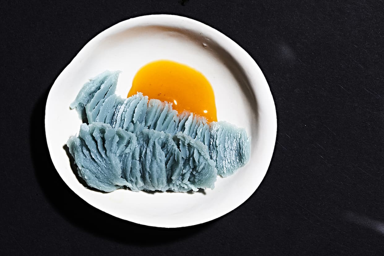 the youth dew & the blue cocoon on a white plate