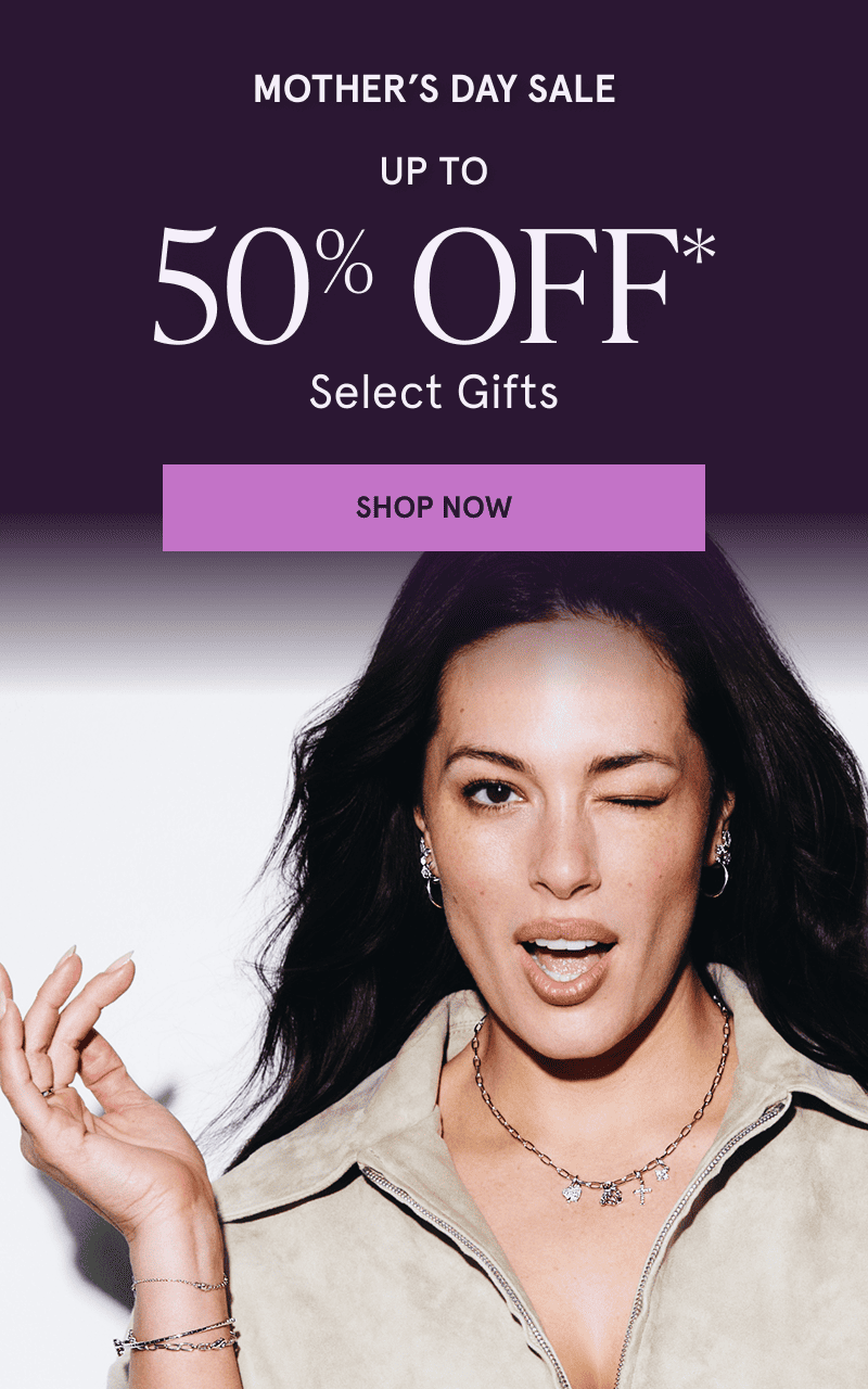 Model Ashley Graham wearing gold gemstone jewelry. Mother’s Day Sale. Up to 50% Select Gifts. Click here to shop now