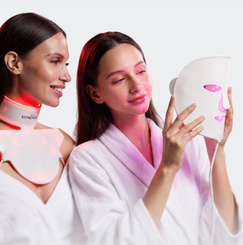 mother and daughter looking at mask, mother wearing collar