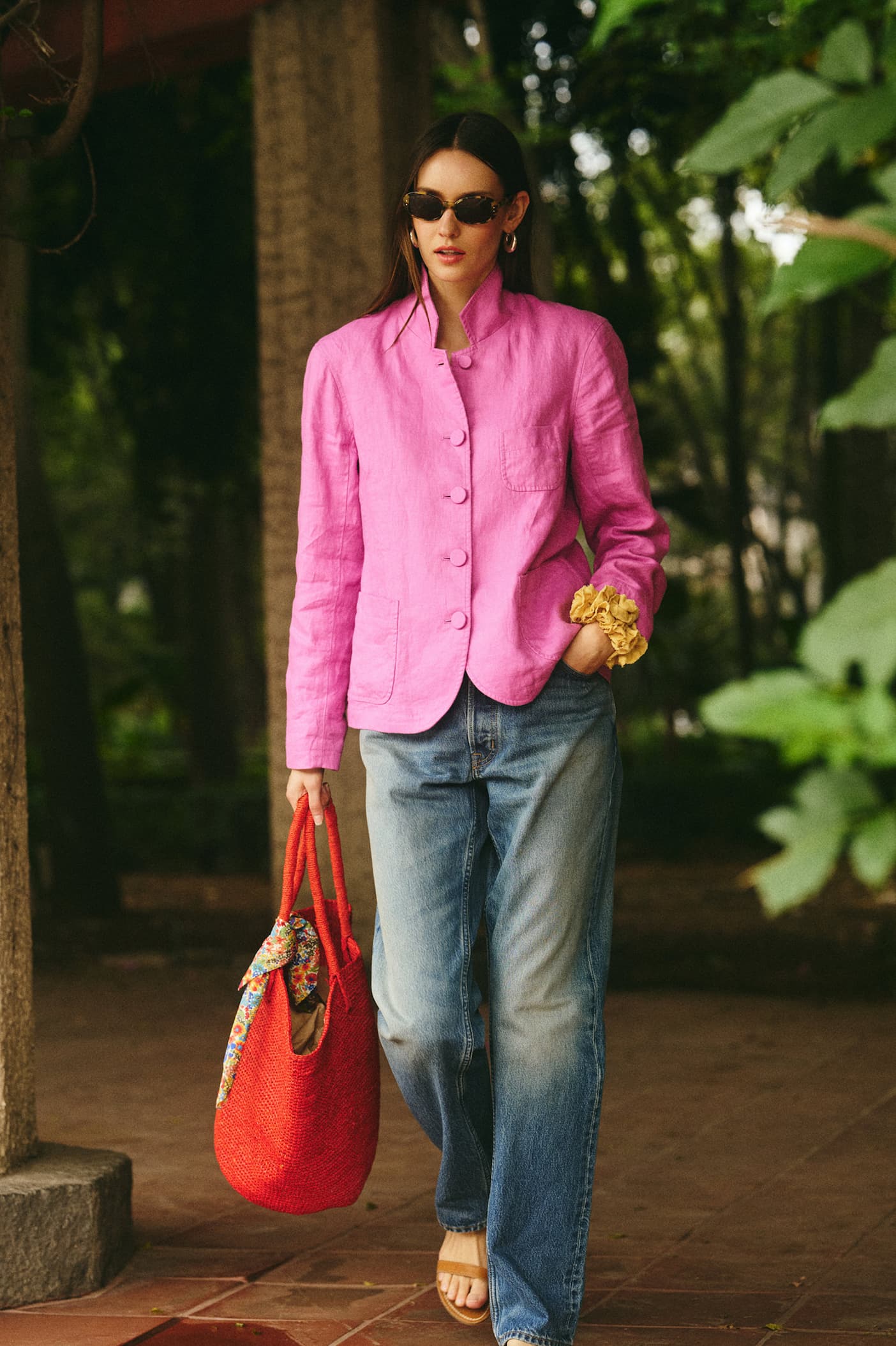 Woman in pink blazer and jeans