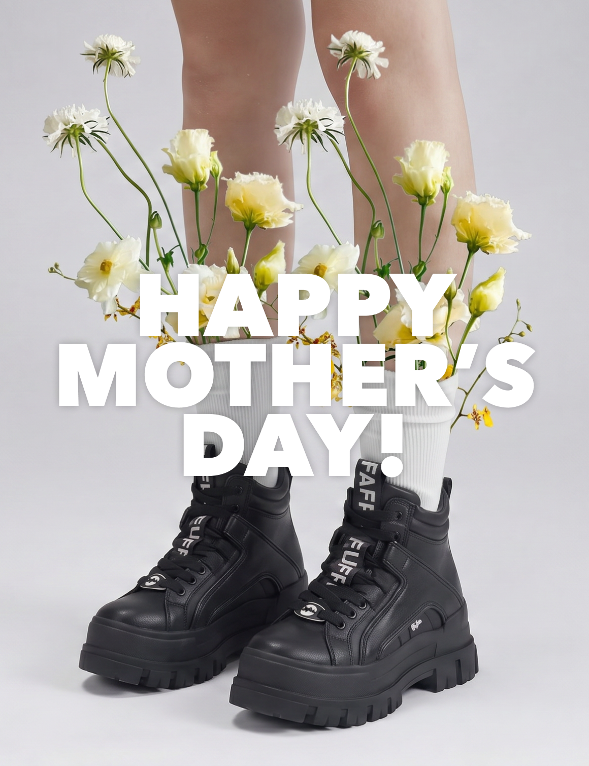 Black platform boots with white socks and flowers tucked in, with ‘Happy Mother’s Day!’ text overlay.