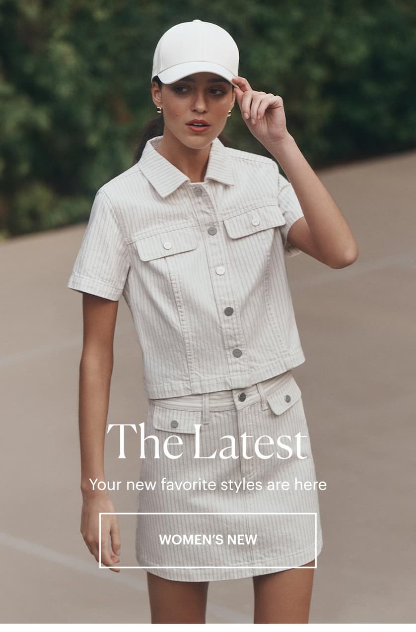 Woman wearing a matching white striped denim top and skirt set with a white cap, standing on a tennis court. The Latest - Your new favorite styles are here. SHOP WOMEN'S NEW ARRIVALS.