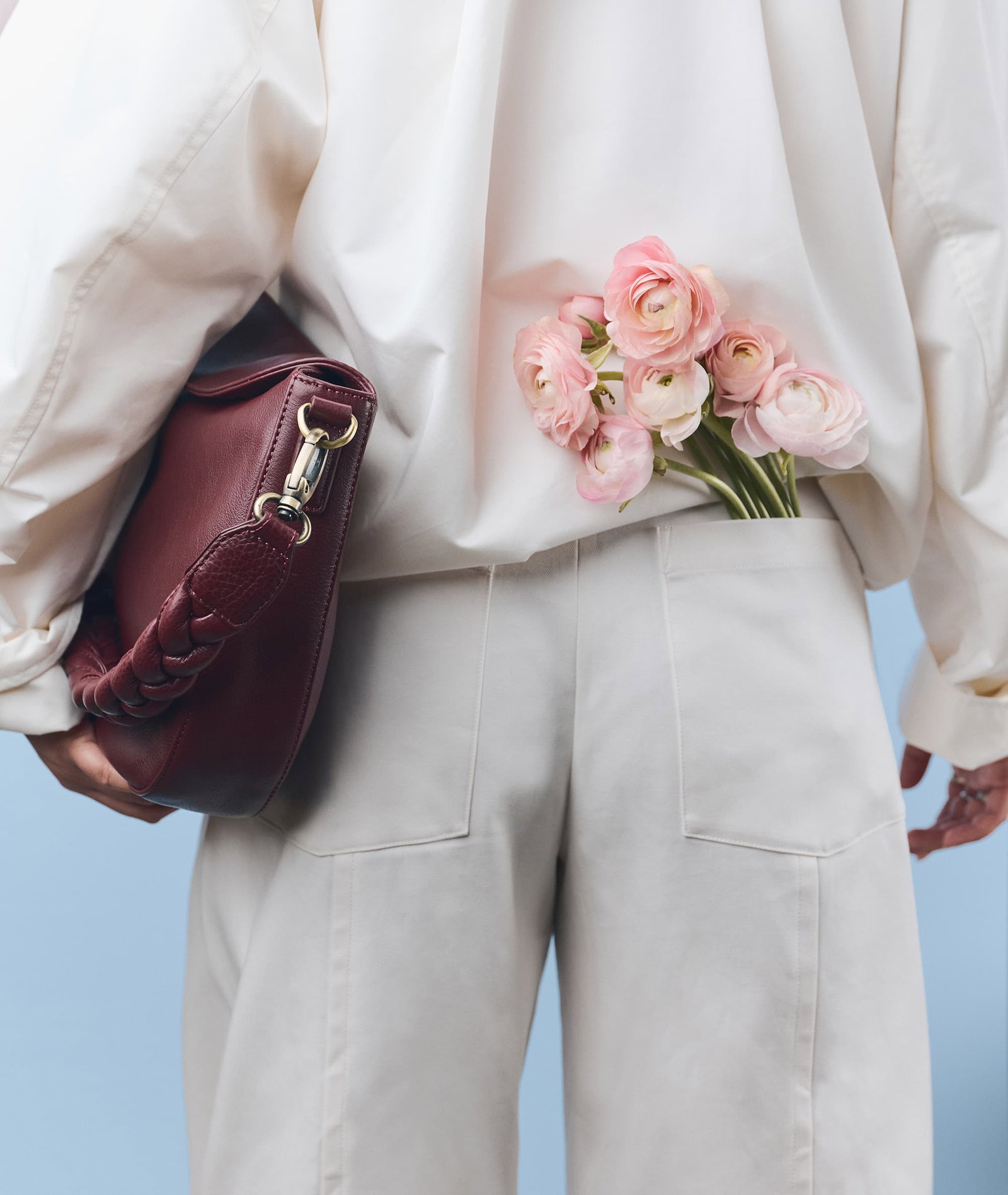 Model holding Lana in Dark Cherry