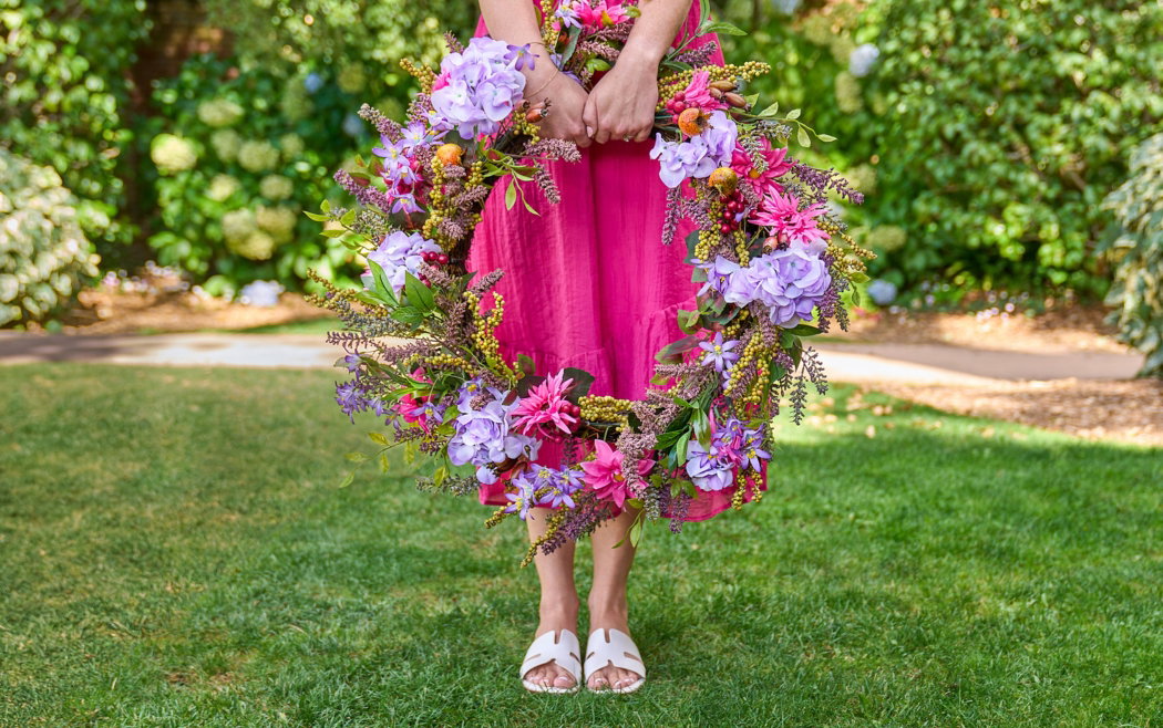 Woman holding Vibrant Summer Bloom Wreath
