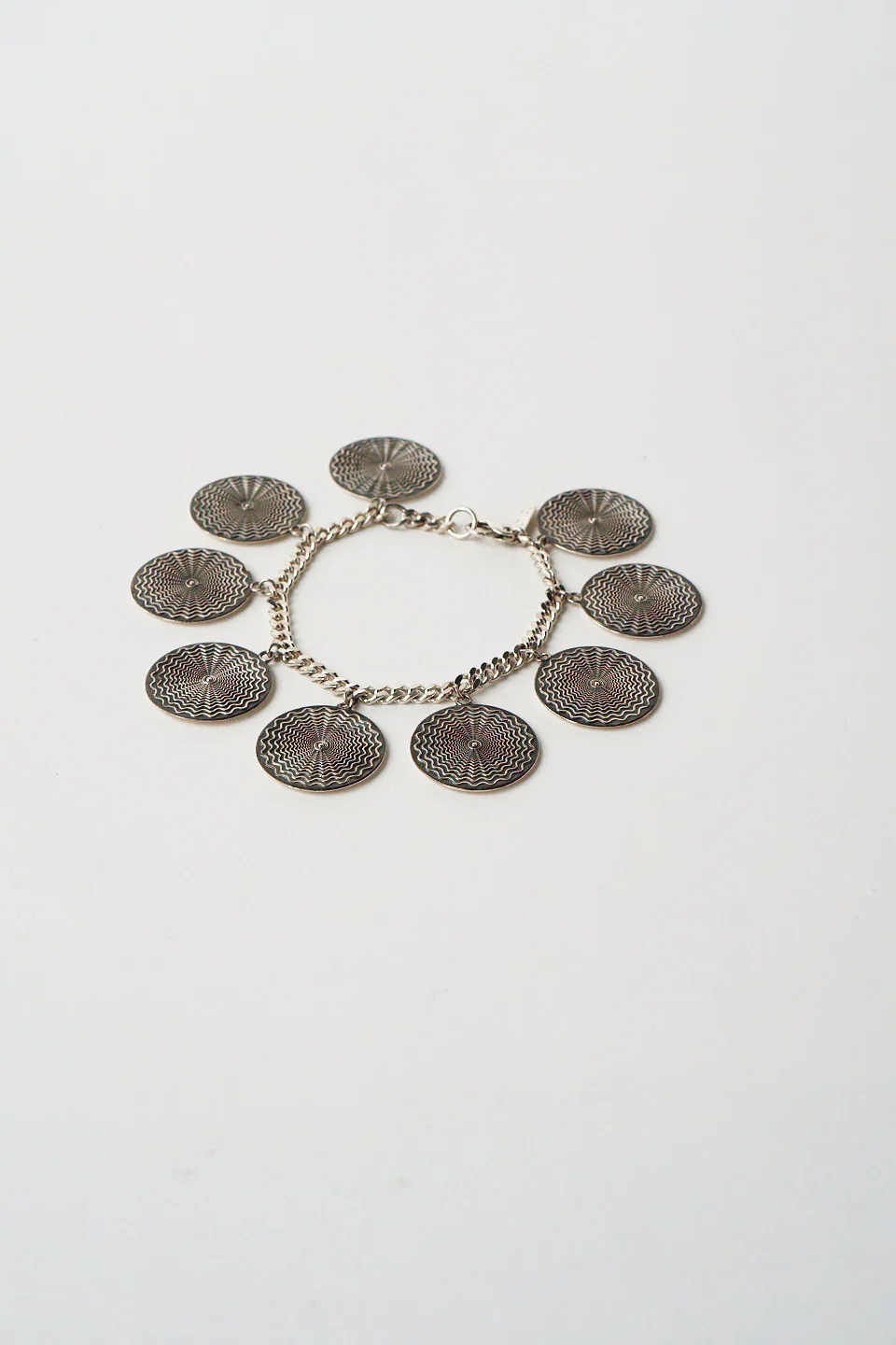 Image of The Chaos Sunburst Charm Bracelet in Sterling Silver