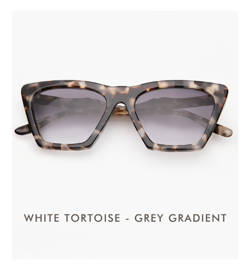 A studio product shot of the Lisbon sunglasses in White Tortoise with Grey Gradient lenses. The frames feature a marbled cream, tan, and black pattern.