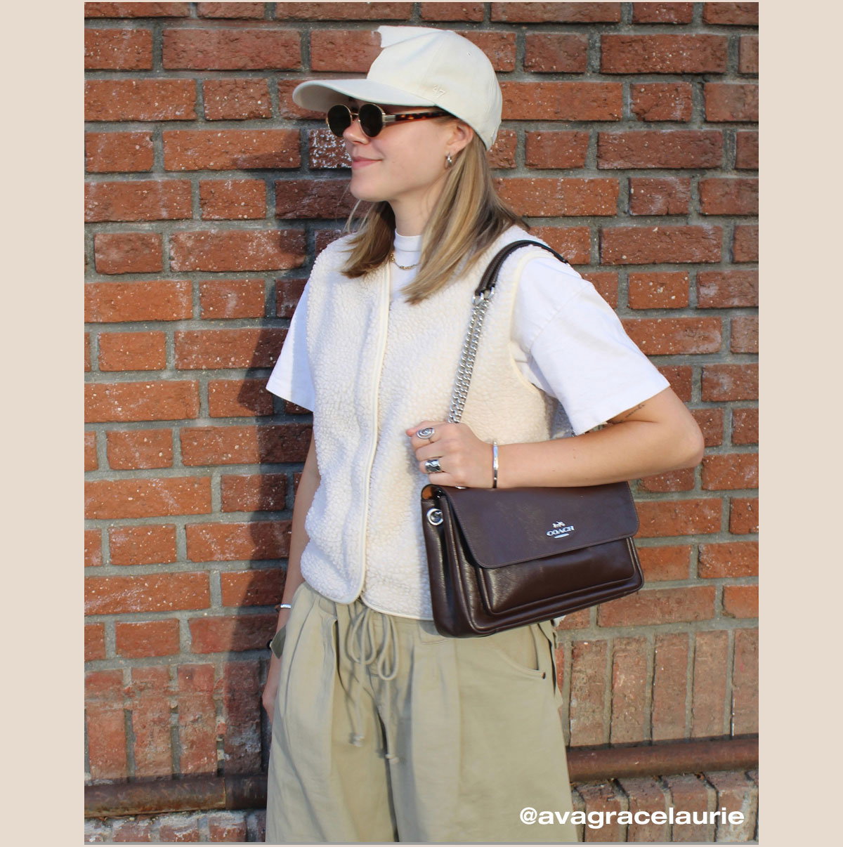 “The glossy leather and silver hardware give this bag a fresh look perfect for summer.” 
