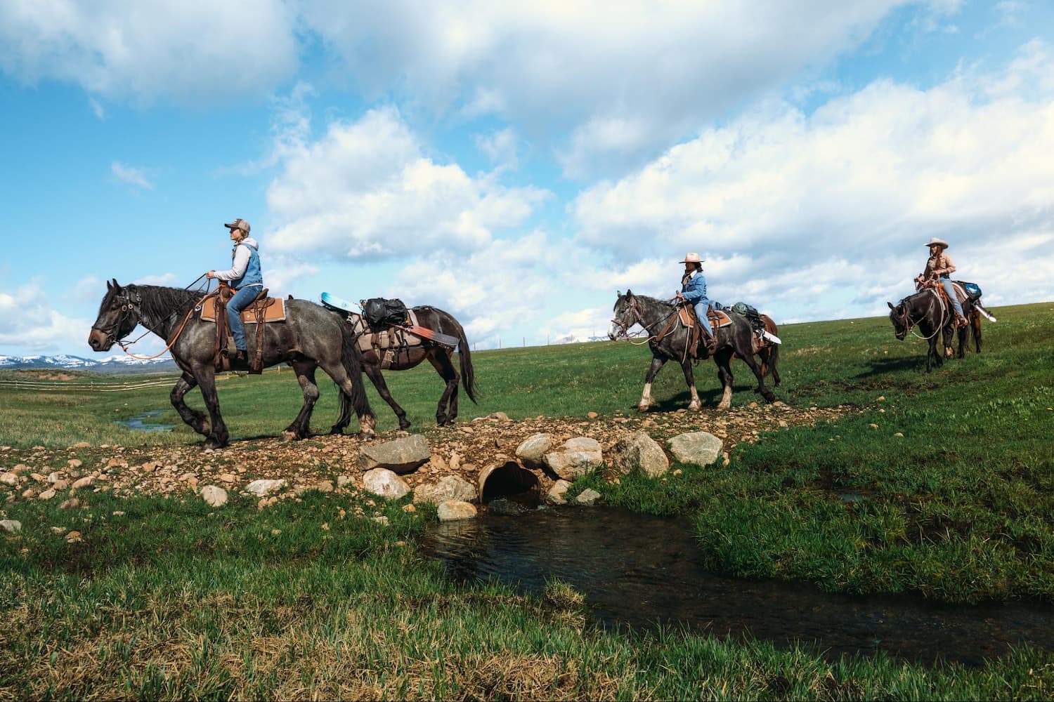 Horseback riders with skis attached